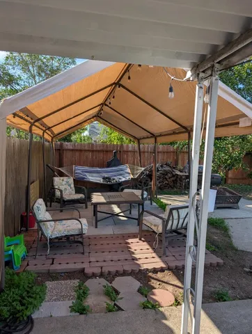 a view of yard with patio