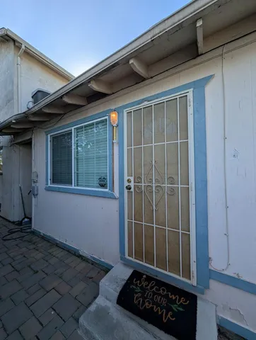 a view of a door and a window