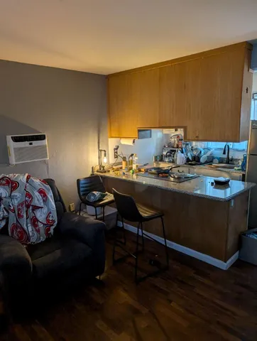 a dining room with a table chairs and a wooden floor