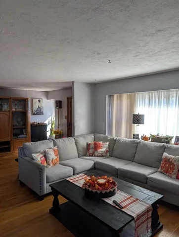 a living room with furniture and a couch