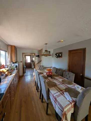 a bedroom with furniture and a wooden floor