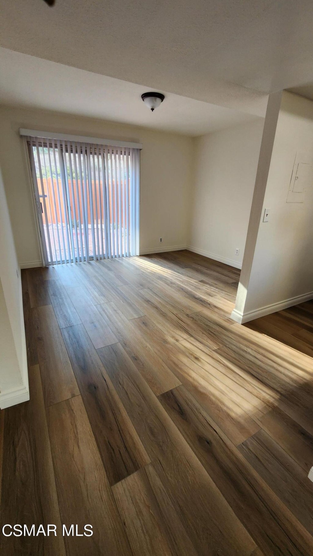a view of a room has wooden floor