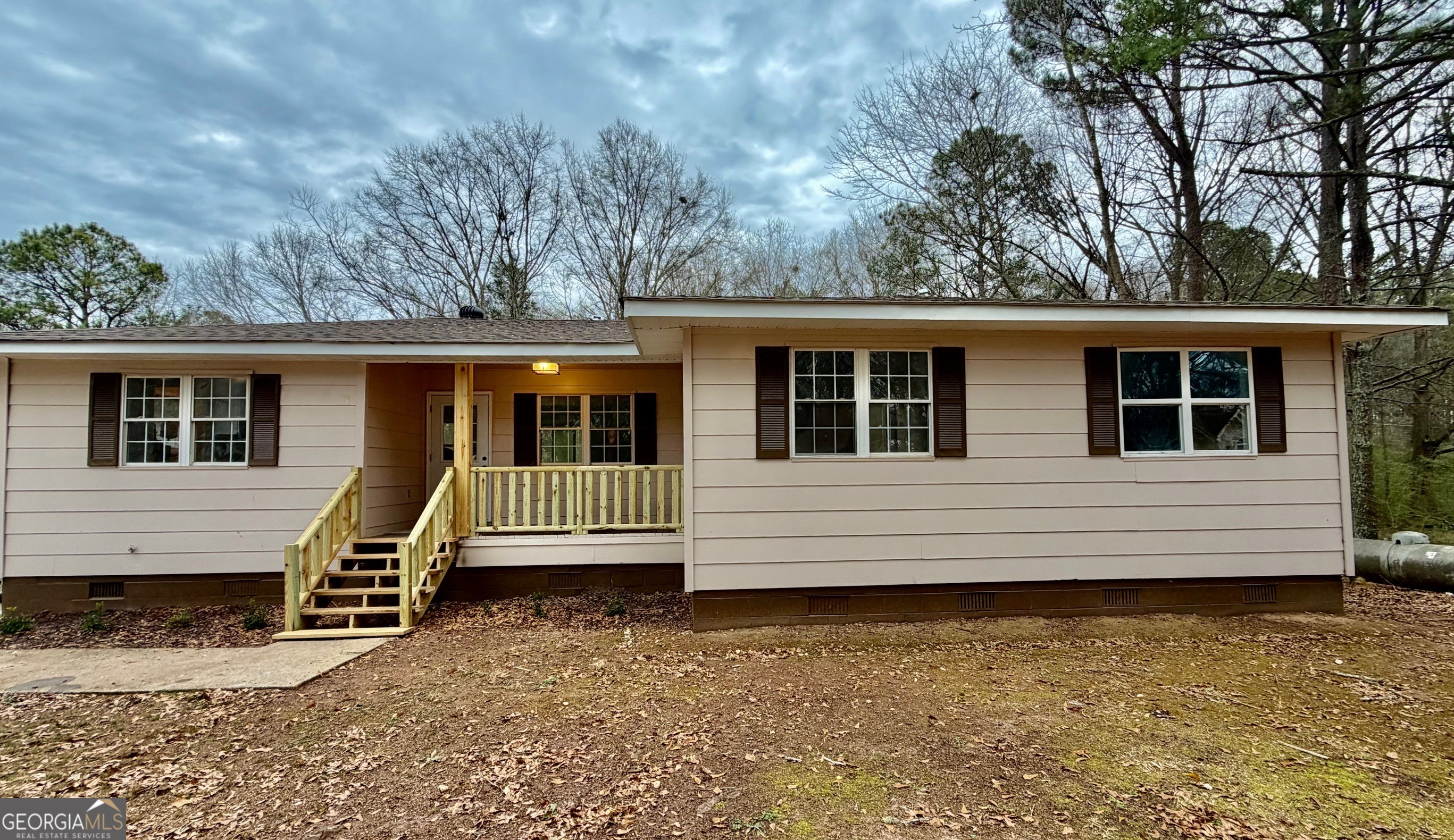 21 Opal Street Luthersville, GA 30251 - Photo 11 of 26 a house with trees in the background