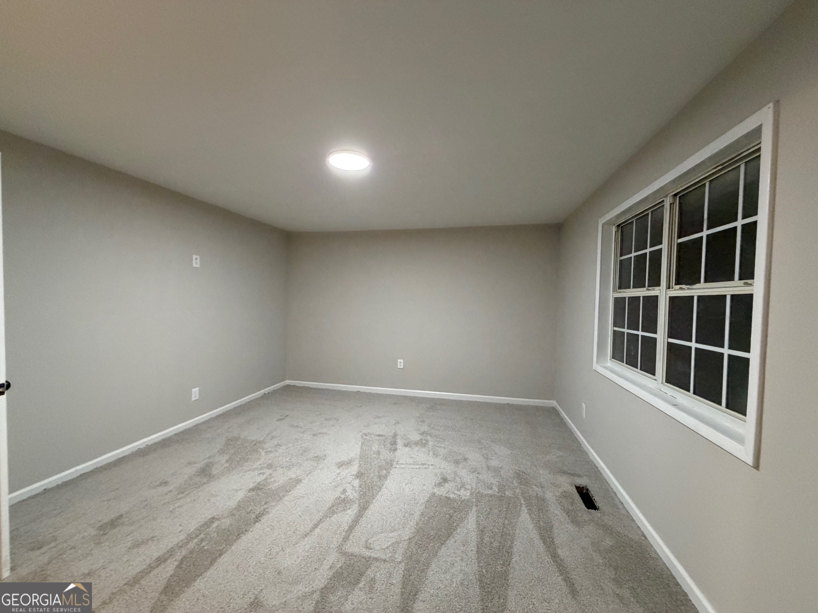 21 Opal Street Luthersville, GA 30251 - Photo 21 of 26 a view of empty room with windows