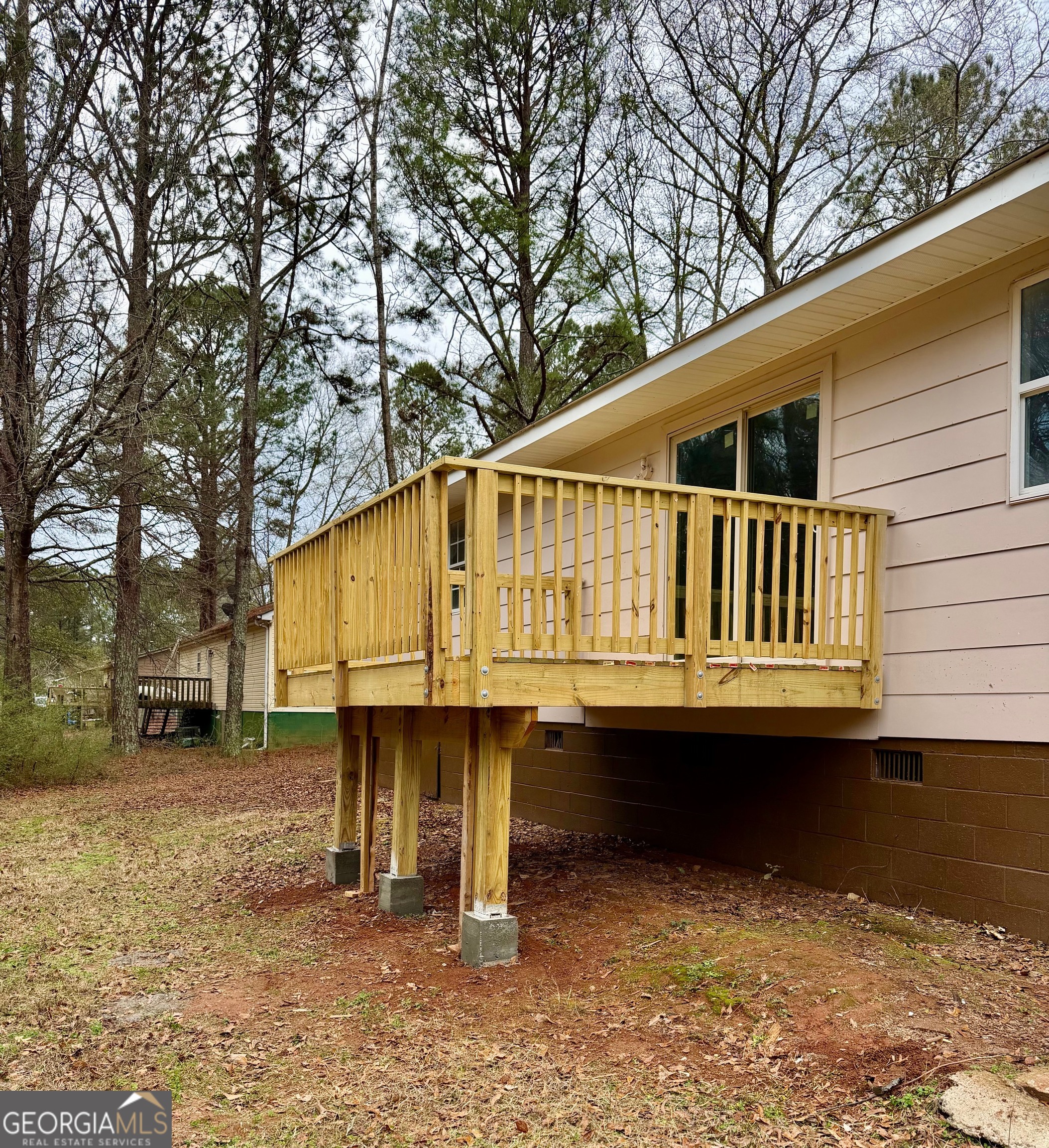 21 Opal Street Luthersville, GA 30251 - Photo 7 of 26 a backyard of a house with lake view and sitting space