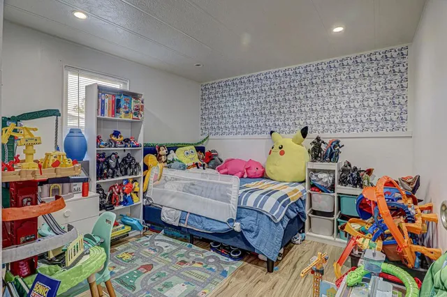 a bedroom with a bed and a couch