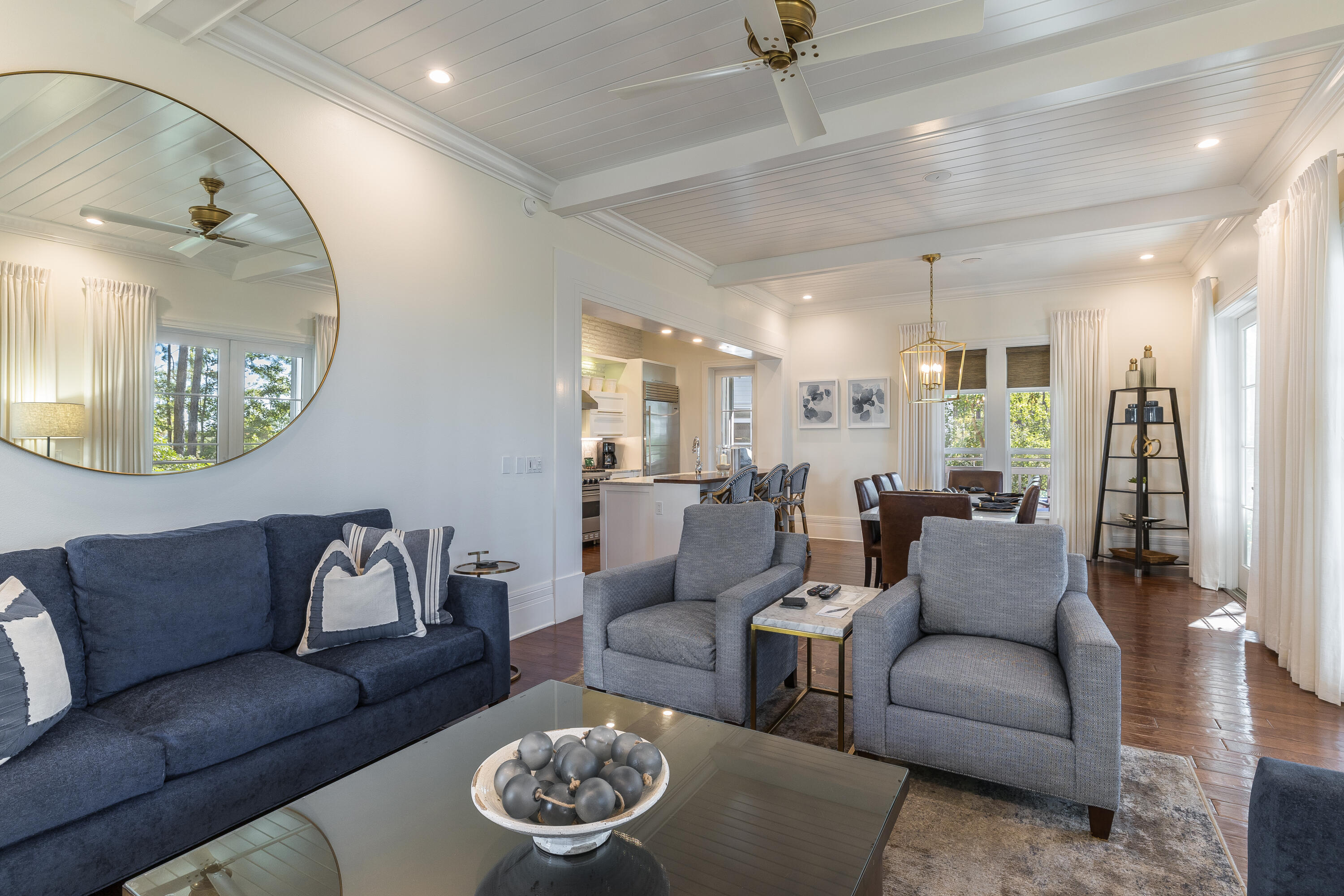 8116 Inspiration Drive, Unit B1 Miramar Beach, FL 32550 - Photo 24 of 31 a living room with furniture and a mirror