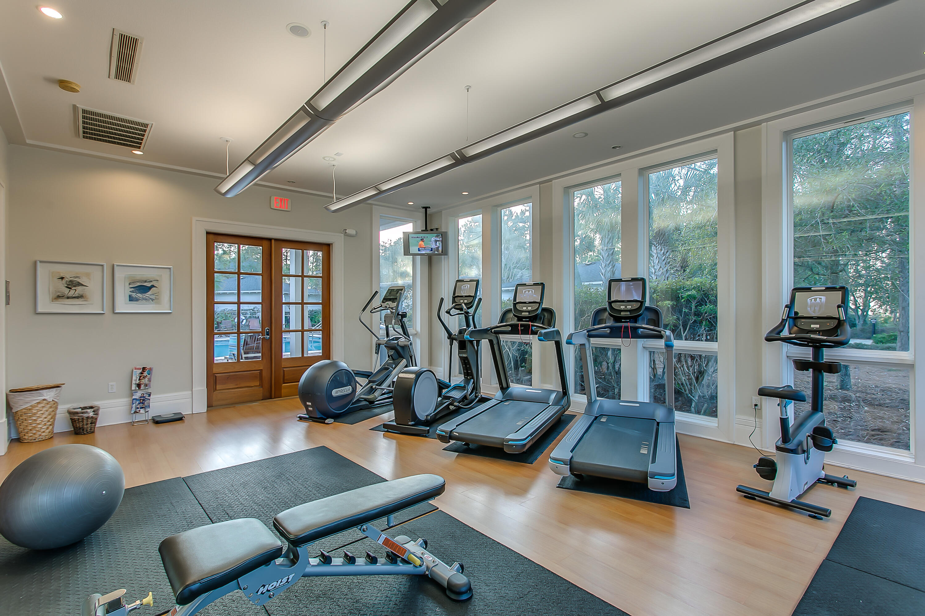8116 Inspiration Drive, Unit B1 Miramar Beach, FL 32550 - Photo 10 of 31 a room with gym equipment and a large window