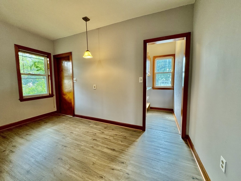 7 Rawson Road, Unit 1 Quincy, MA 02170 - Photo 9 of 17 a view of a room with wooden floor and window
