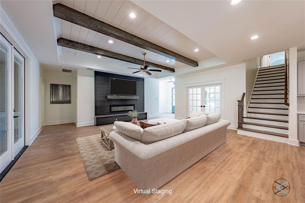 114 Castlewood Road Enchanted Oaks, TX 75156 - Photo 11 of 24 a living room with furniture and a flat screen tv