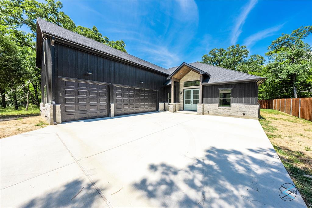 114 Castlewood Road Enchanted Oaks, TX 75156 - Photo 7 of 24 a house view with a outdoor space