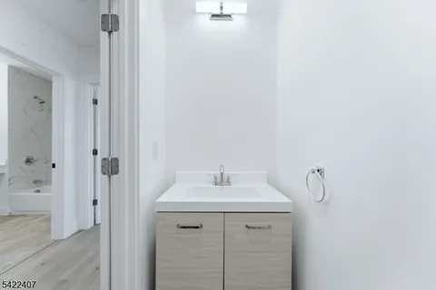 a bathroom with a sink and mirror