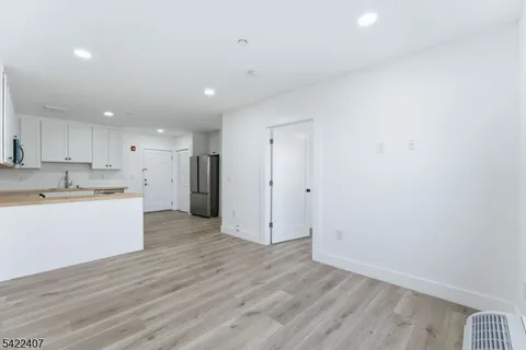 a view of kitchen with wooden floor