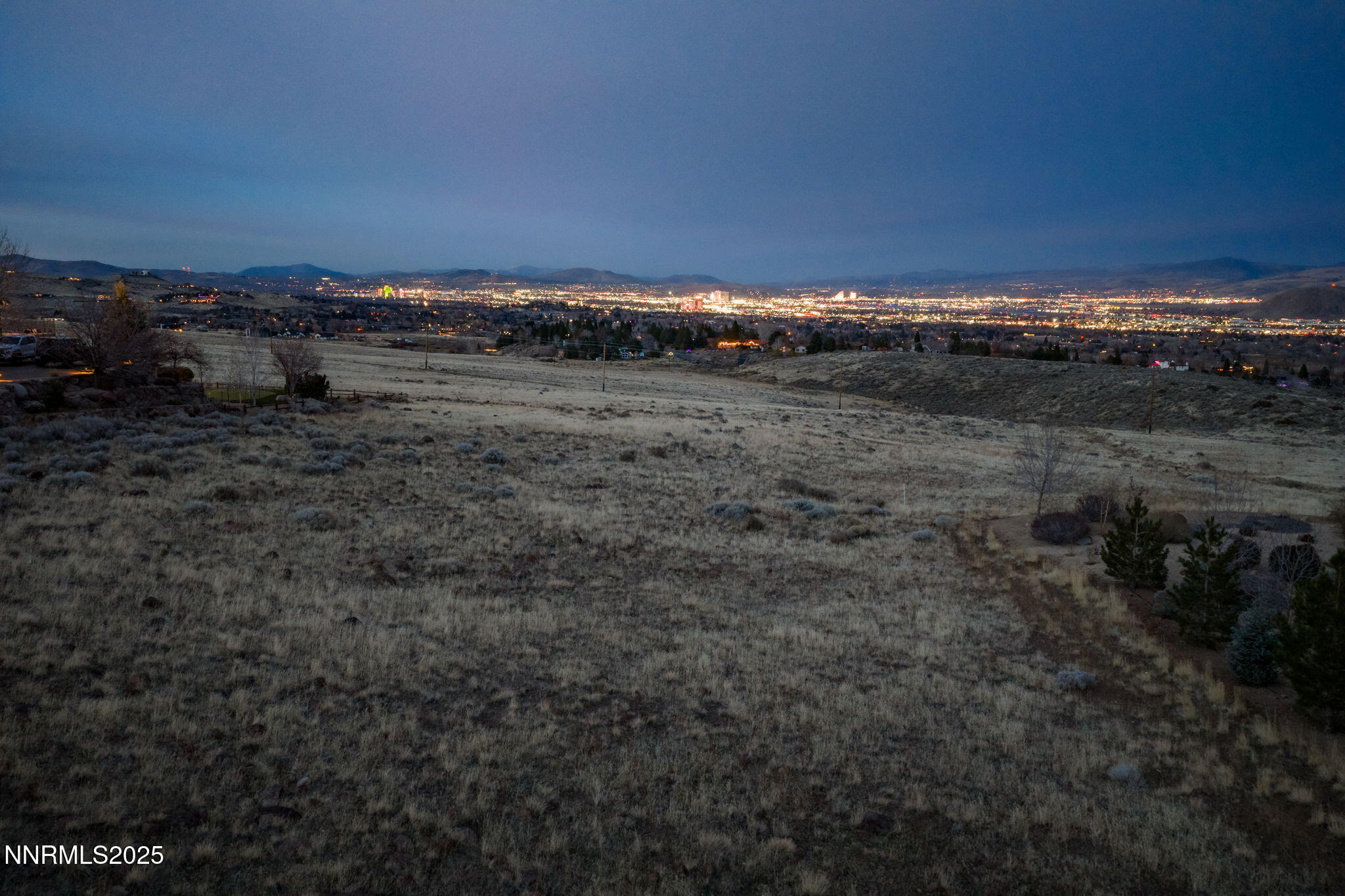 390 Questa Court Reno, NV 89511 - Photo 26 of 29 a view of a field of house with sky view