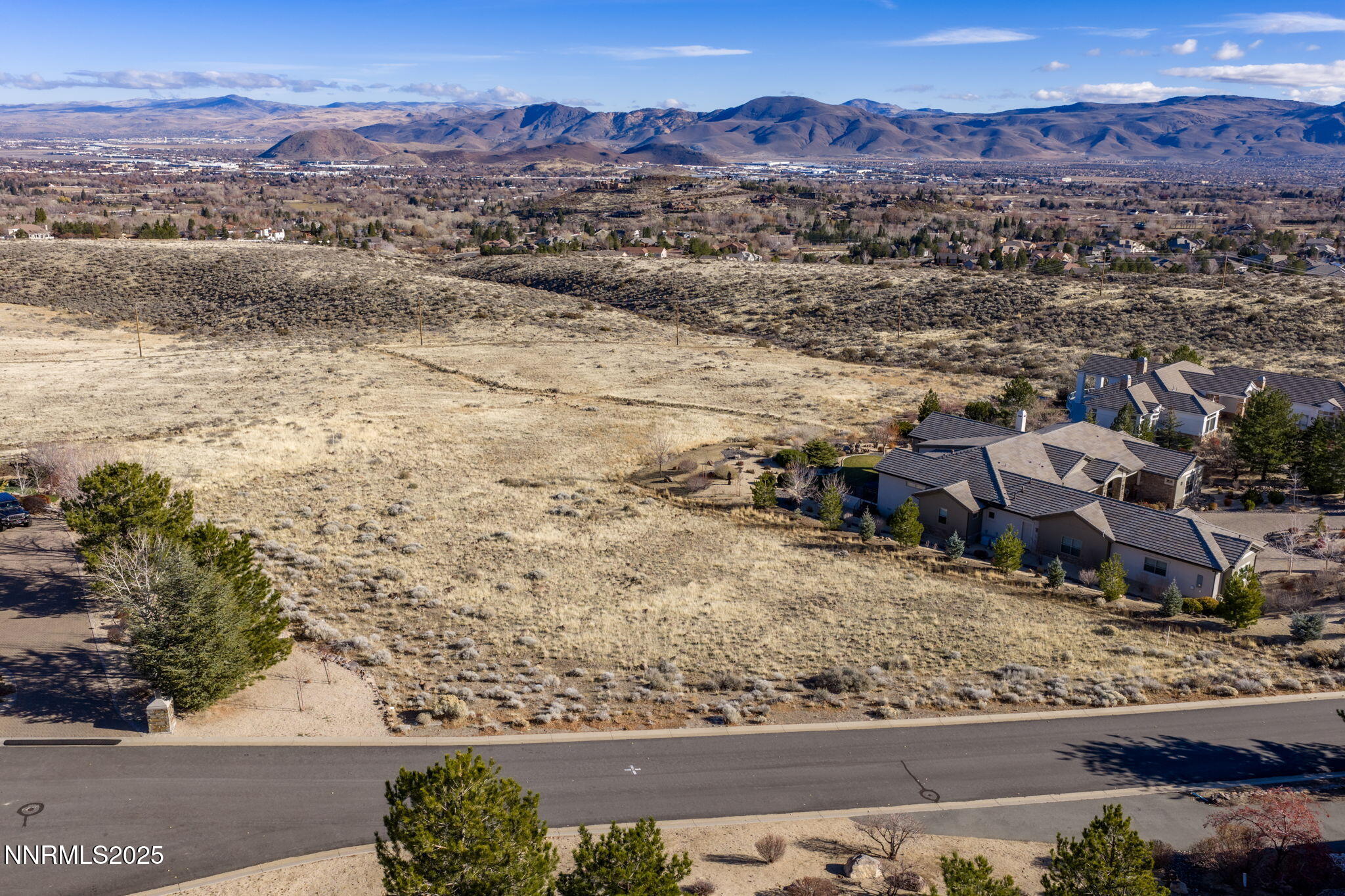 390 Questa Court Reno, NV 89511 - Photo 3 of 29 an aerial view of residential houses with outdoor space and trees