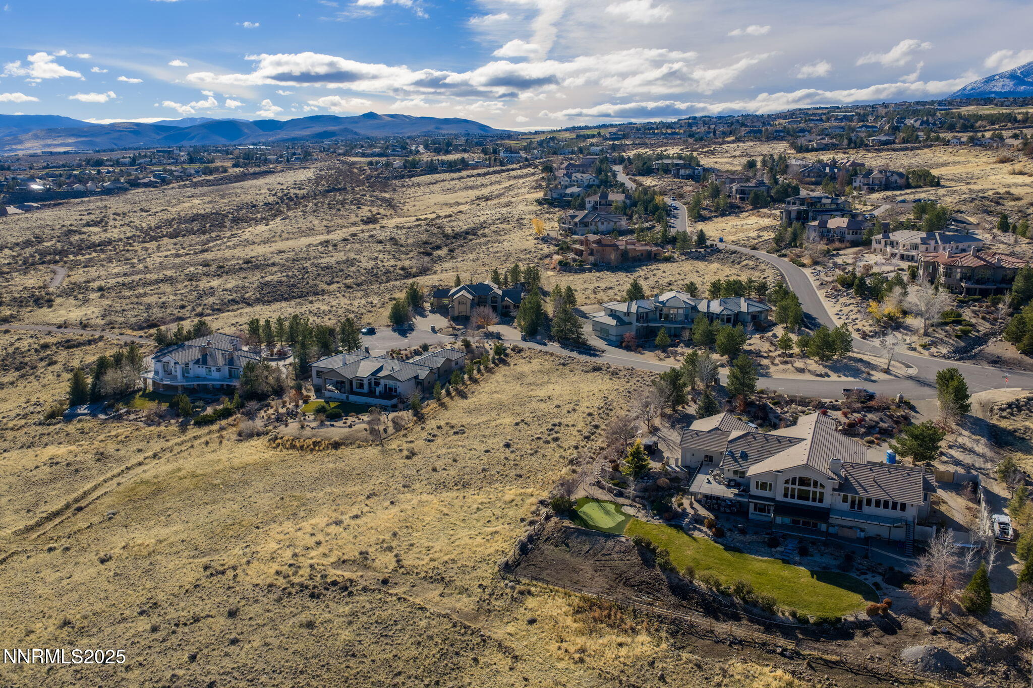 390 Questa Court Reno, NV 89511 - Photo 6 of 29 an aerial view of residential houses with outdoor space