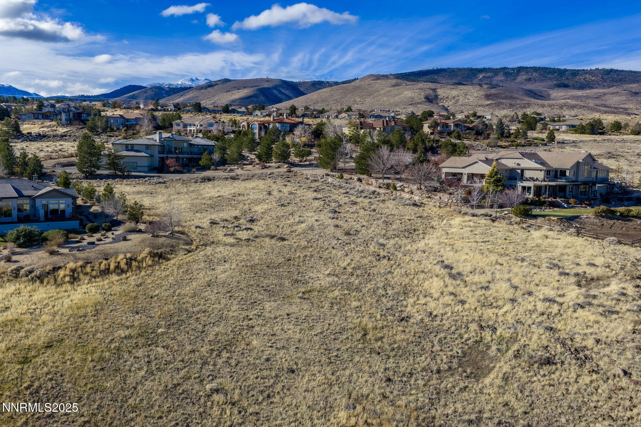 390 Questa Court Reno, NV 89511 - Photo 8 of 29 a view of a town with mountains in the background