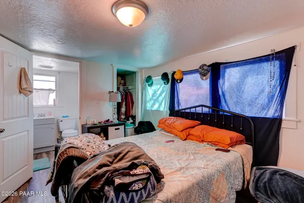 a bedroom with a bed and window