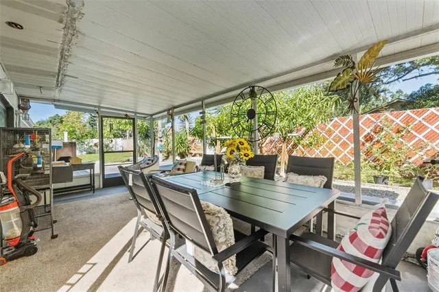 a view of a dining room with furniture window and outside view