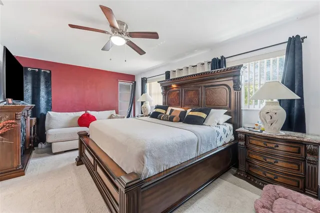 a bed room with a bed and a chandelier