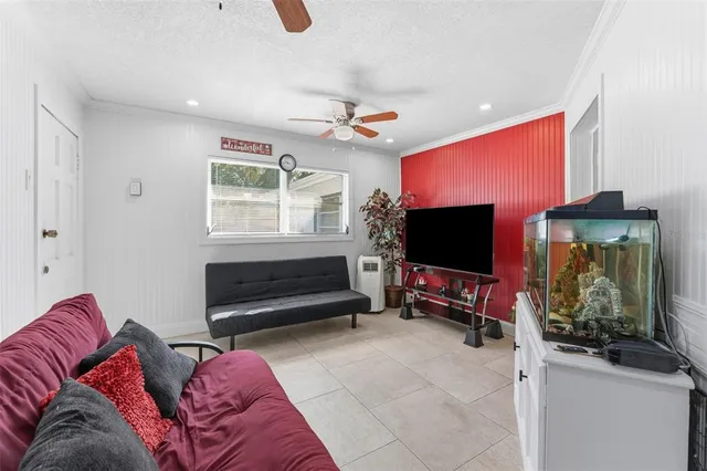 a living room with furniture and a flat screen tv