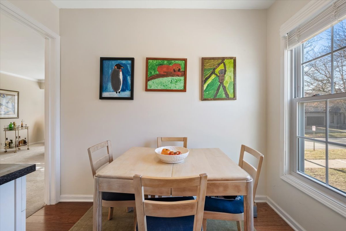 601 Ridge Road, Unit 202 Wilmette, IL 60091 - Photo 12 of 17 a view of a dining room with furniture and a window