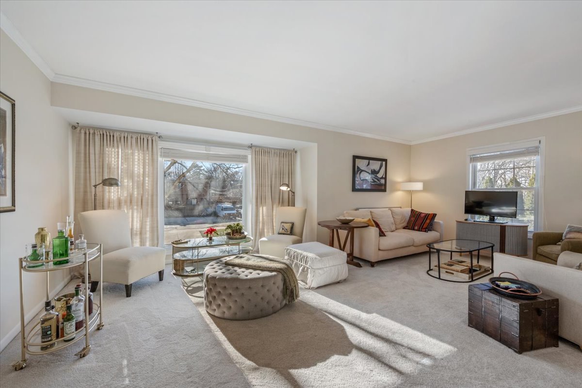 601 Ridge Road, Unit 202 Wilmette, IL 60091 - Photo 4 of 17 a living room with furniture and a large window