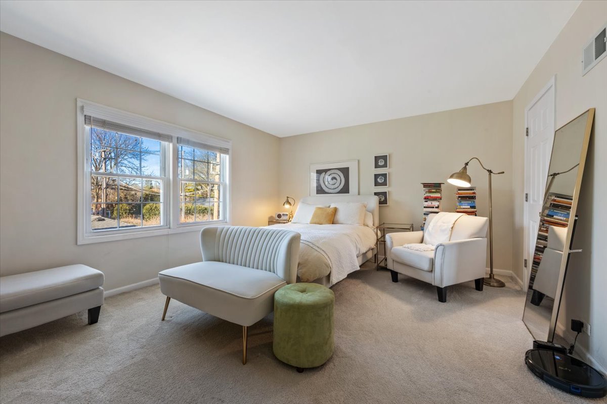 601 Ridge Road, Unit 202 Wilmette, IL 60091 - Photo 7 of 17 a bedroom with furniture and a window