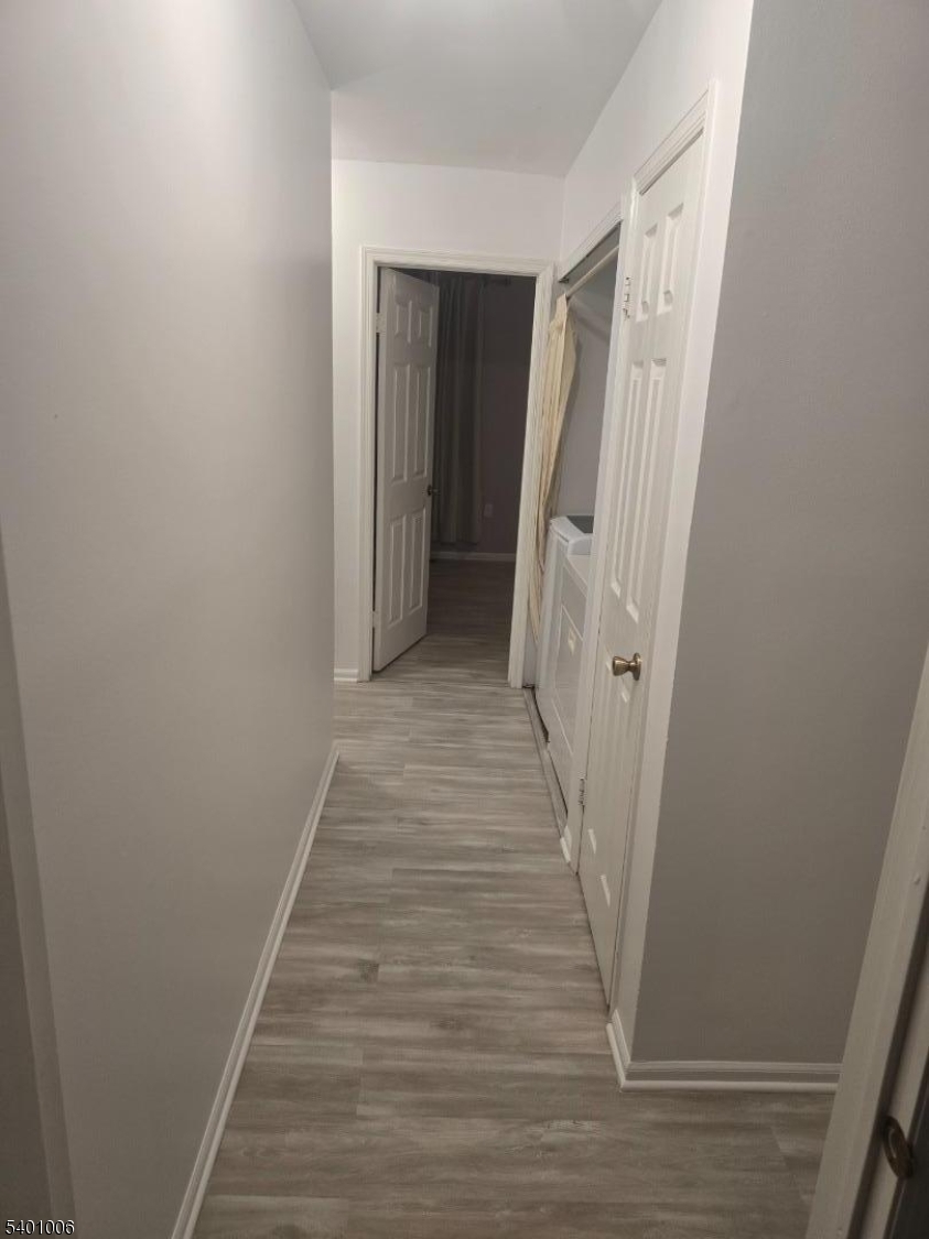 754 Darlington Drive Old Bridge, NJ 08857 - Photo 12 of 19 a view of a hallway with wooden floor and staircase