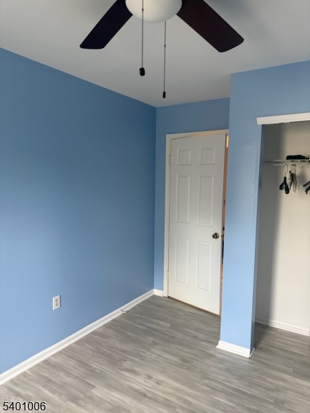 754 Darlington Drive Old Bridge, NJ 08857 - Photo 13 of 19 a view of an empty room with wooden floor