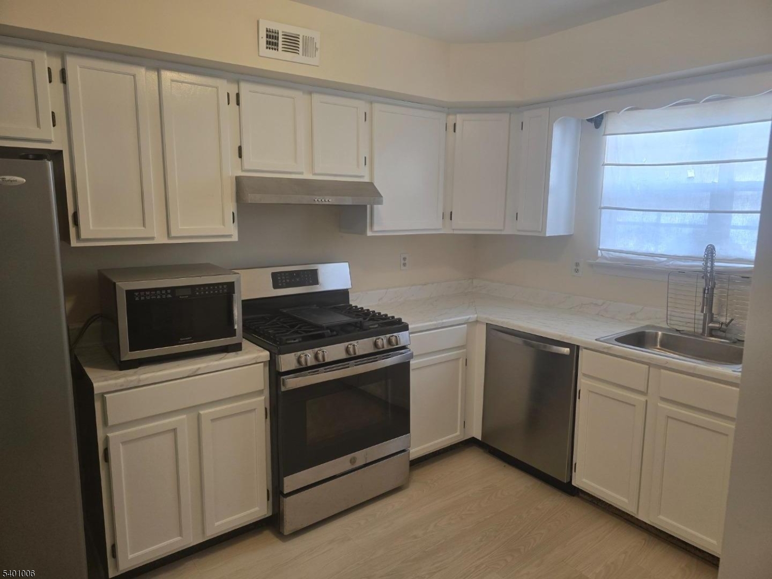 754 Darlington Drive Old Bridge, NJ 08857 - Photo 3 of 19 a kitchen with white cabinets and appliances