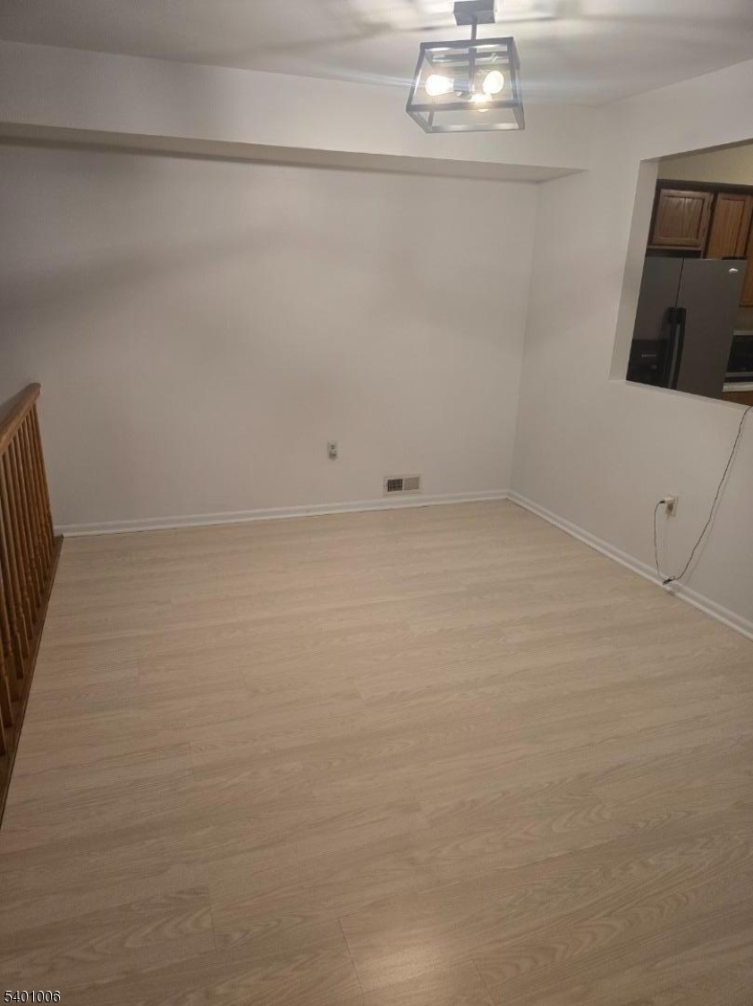 754 Darlington Drive Old Bridge, NJ 08857 - Photo 5 of 19 a view of wooden floor and chandelier in a room