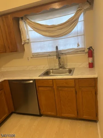 a kitchen with a sink and cabinets