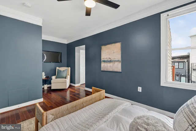 a bedroom with a bed and a night stand