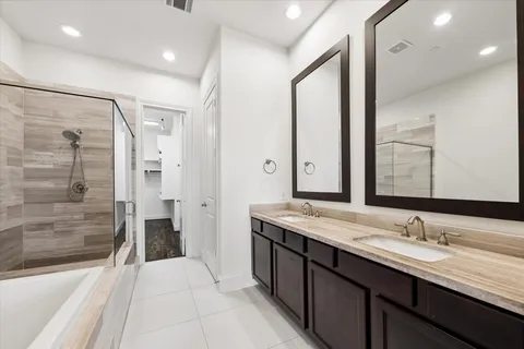 a bathroom with a bathtub and shower