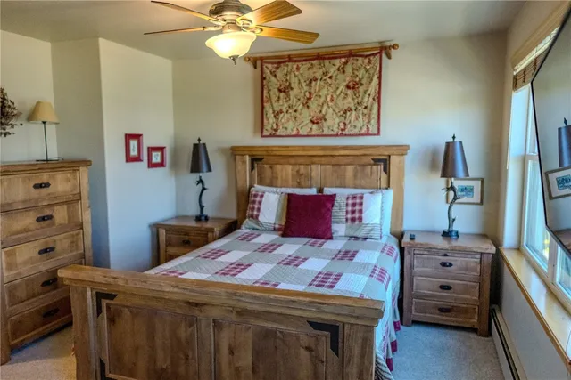 a bedroom with a bed and a television