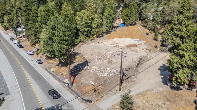 a view of a tree in front of a house