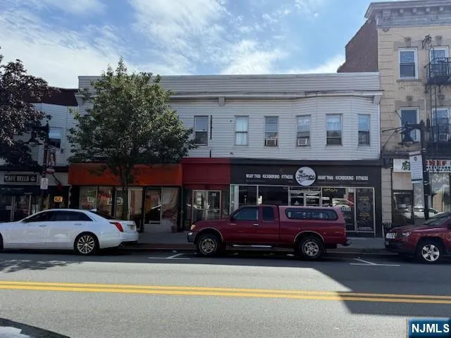a view of a cars park in front of a building