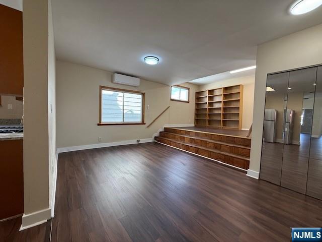 234 Paterson Avenue, Unit 1 East Rutherford, NJ 07073 - Photo 11 of 15 a view of empty room with wooden floor and fan