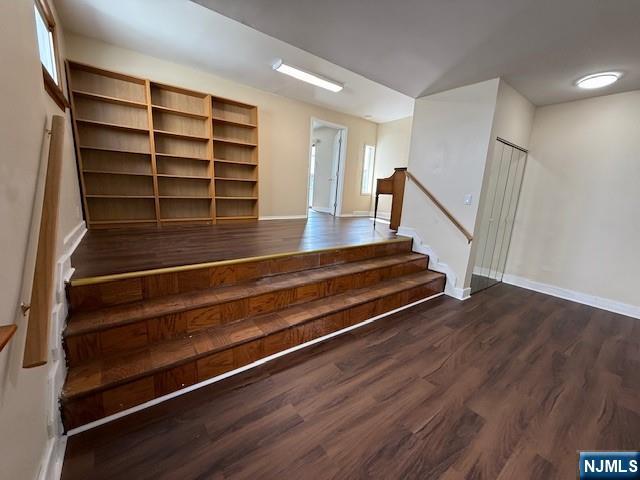234 Paterson Avenue, Unit 1 East Rutherford, NJ 07073 - Photo 12 of 15 a view of room with wooden floor and stairs