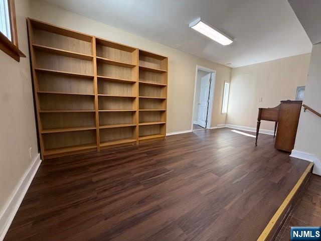 234 Paterson Avenue, Unit 1 East Rutherford, NJ 07073 - Photo 13 of 15 a view of an empty room with wooden floor and a window
