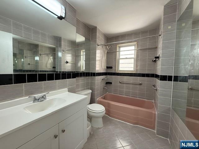 234 Paterson Avenue, Unit 1 East Rutherford, NJ 07073 - Photo 10 of 15 a bathroom with a sink a toilet and shower