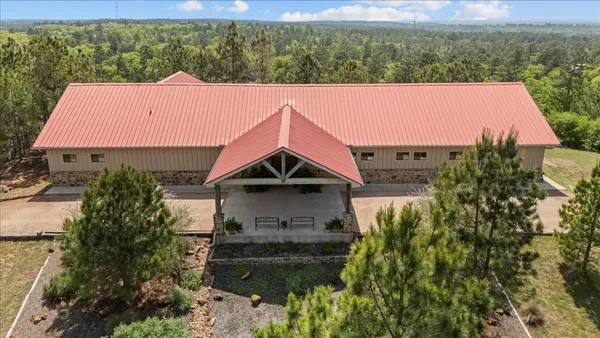 a aerial view of a house with a yard