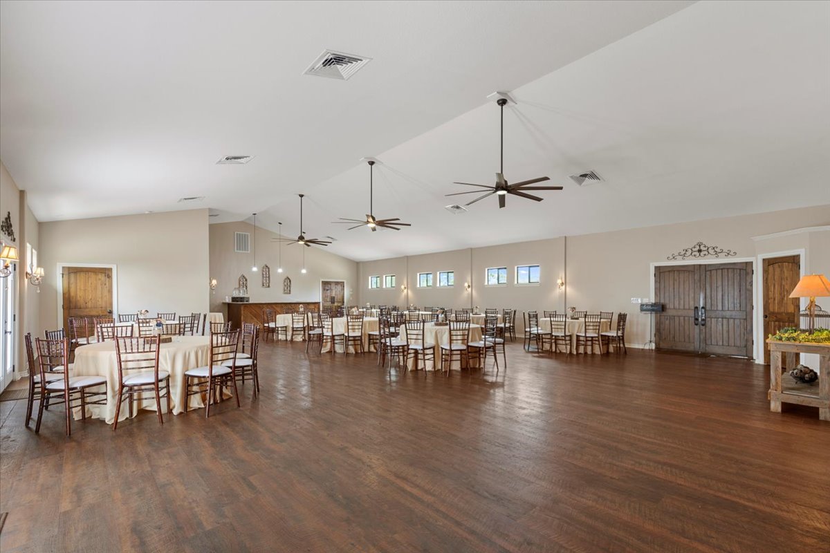 178 Pine Tree Loop Bastrop, TX 78602 - Photo 13 of 40 a view of a kitchen and a dining table chairs
