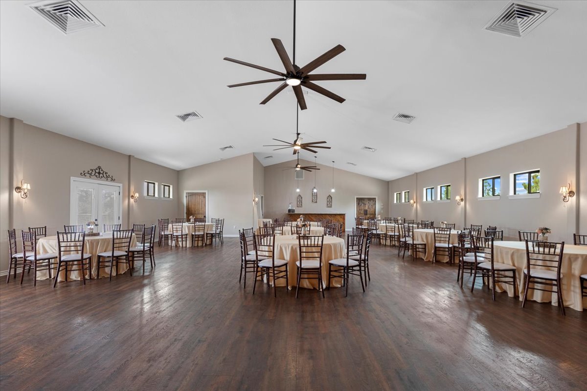 178 Pine Tree Loop Bastrop, TX 78602 - Photo 15 of 40 a dining room with furniture wooden floor and a rug