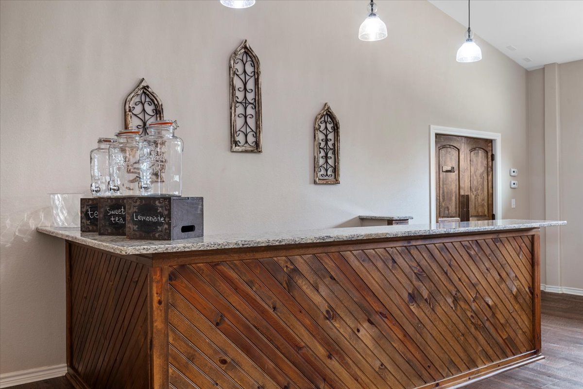 178 Pine Tree Loop Bastrop, TX 78602 - Photo 17 of 40 a view of a hardwood floor and a chandelier fan