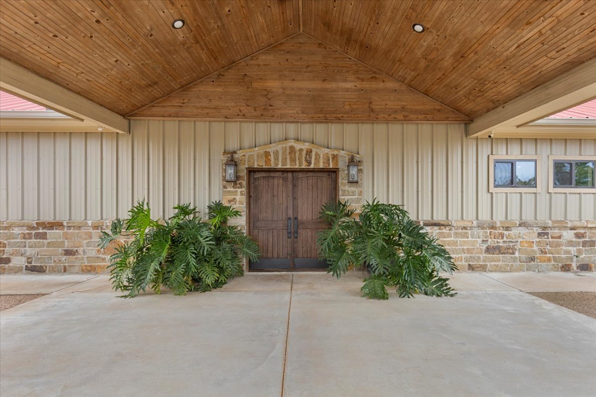 178 Pine Tree Loop Bastrop, TX 78602 - Photo 9 of 40 a front view of a house with garden