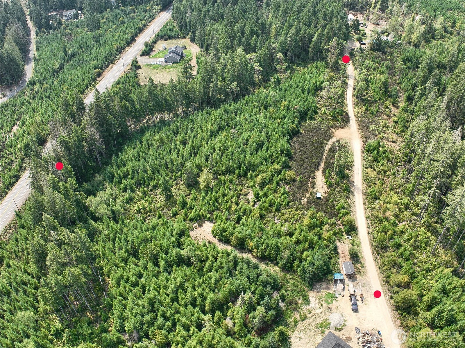 200 Roos Court Grapeview, WA 98546 - Photo 2 of 2 an aerial view of residential house with outdoor space and trees all around