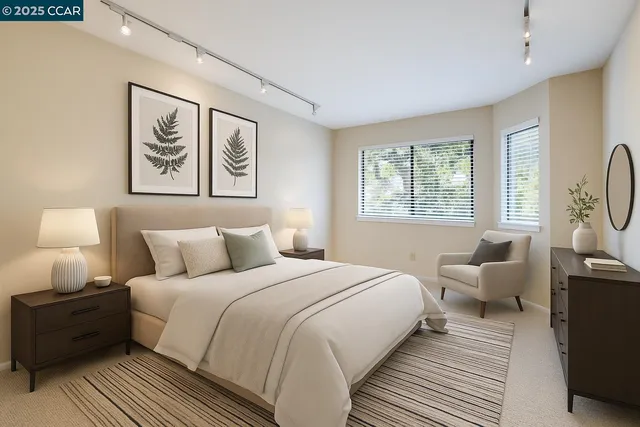 a bedroom with bed and a large window