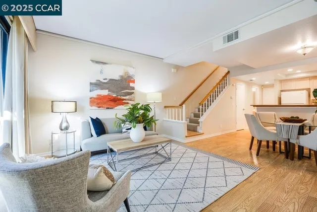 a living room with furniture and a table